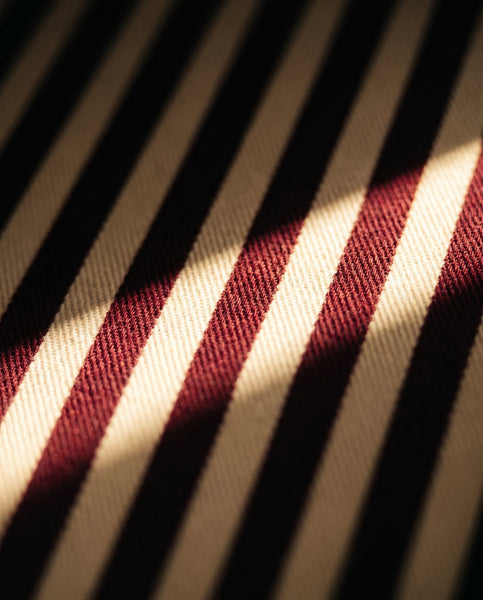 The Petite Christmas Eve Trunk - The burgundy and cream striped lining inside the Christmas Eve Trunk